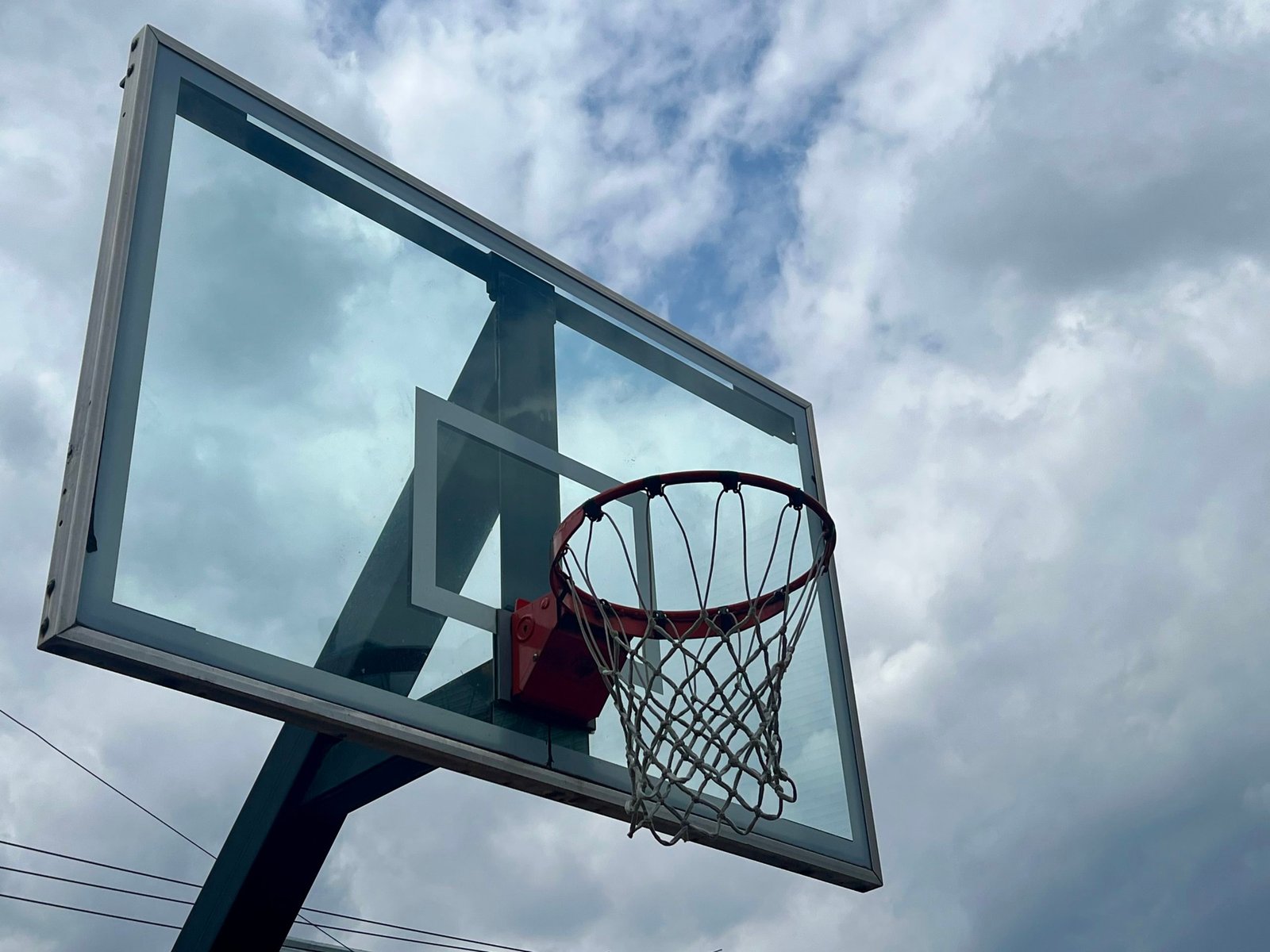 cloudy sky and basketball hoop